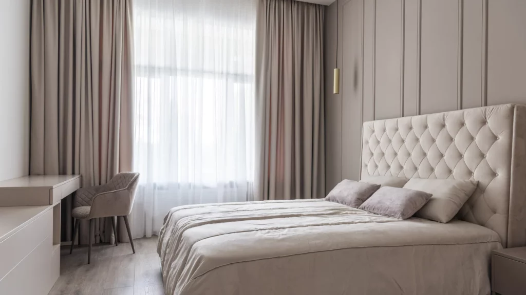 Minimal bedroom with sheer curtains and large windows
